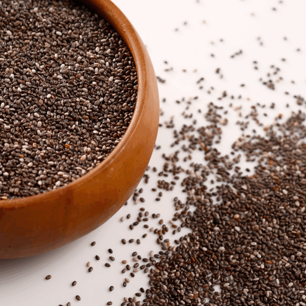 Chia seeds in a wooden bowl, organic and conventional market overview